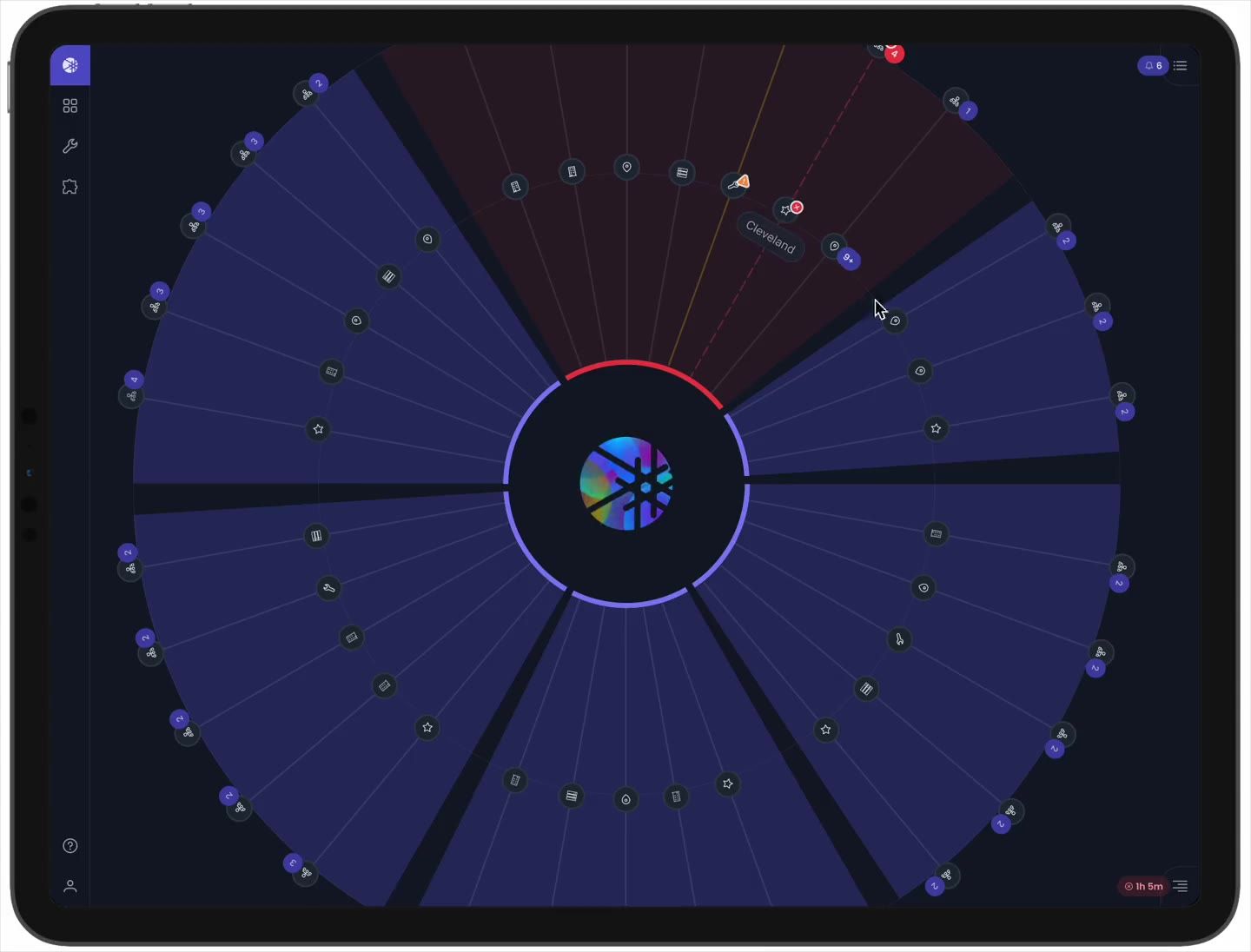 On the radial Region US East 1 topology, a red segment shades a group of sites; the cursor moves across sites and edge devices in the segment, surfacing their status, then settles on the affected edge.