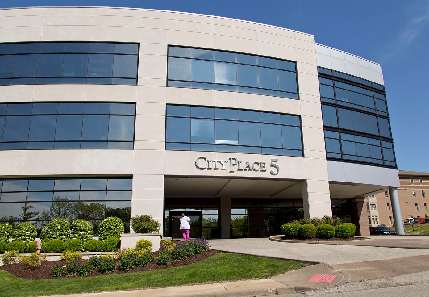 The Mid County Orthopaedic main office, a curved glass and stone medical building